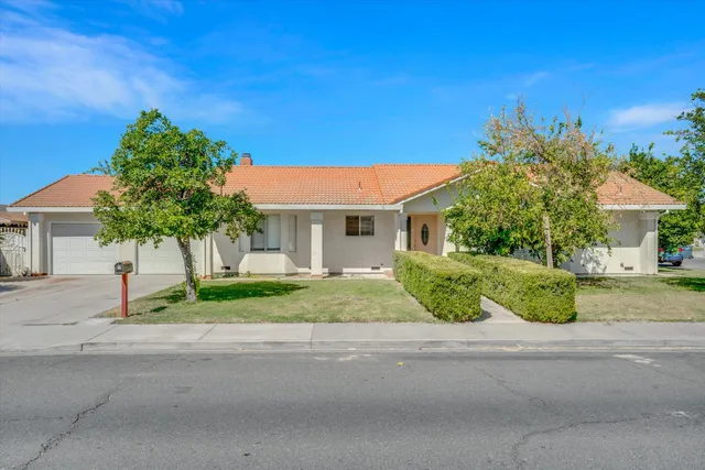 front view of a house with a street