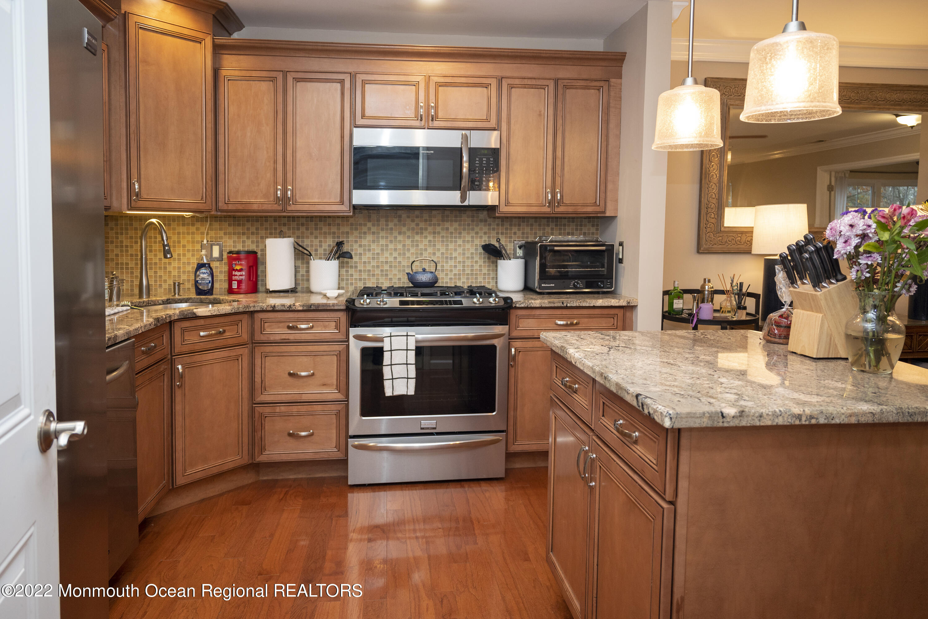 511-7 Harding Road Freehold, NJ 07728 - Photo 5 of 19 a kitchen with stainless steel appliances granite countertop a stove a sink and a microwave