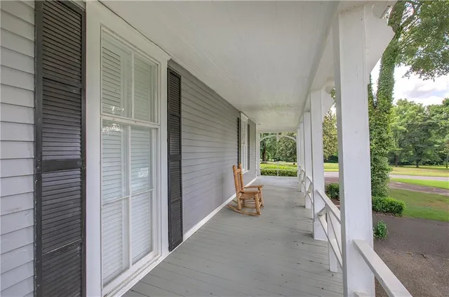 a view of a dining room with furniture kitchen and chandelier