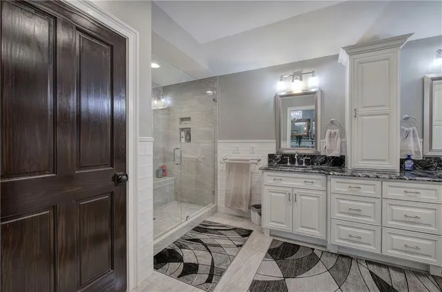 a view of a chair and table in backyard of the house