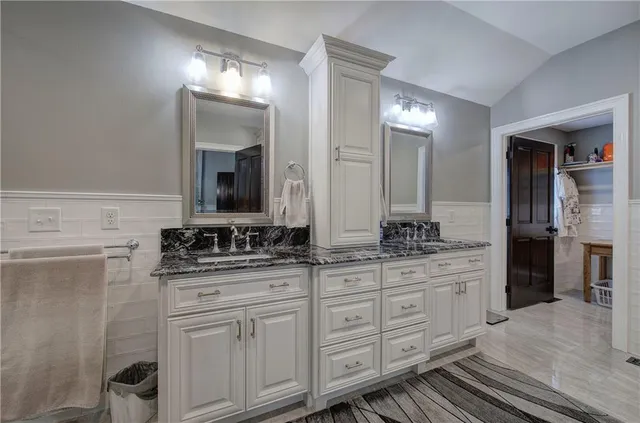 a view of a chair and table in backyard of the house