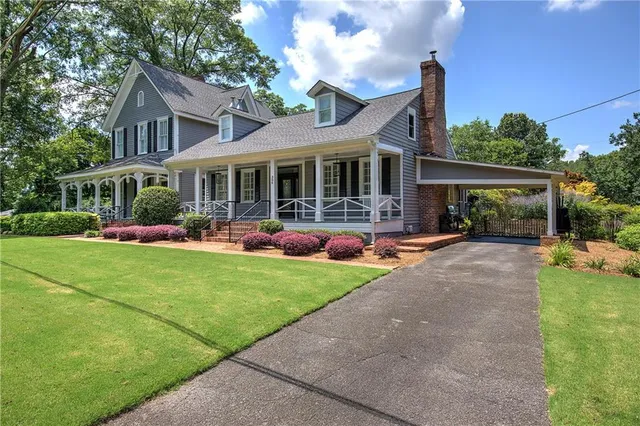 a front view of a house with a porch