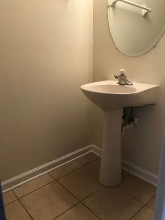 a view of a room with a windows and chandelier