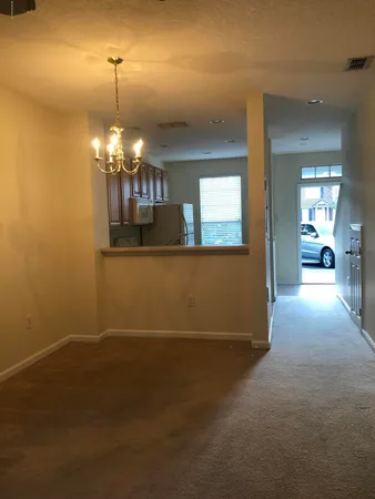 a kitchen with stainless steel appliances a stove a sink and a refrigerator