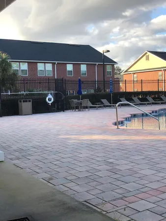 a view of a park with swings and slides