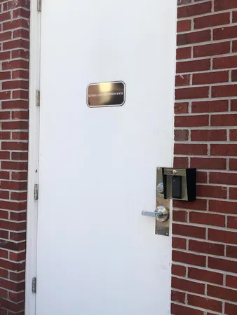 a view of a hallway with wooden shelves