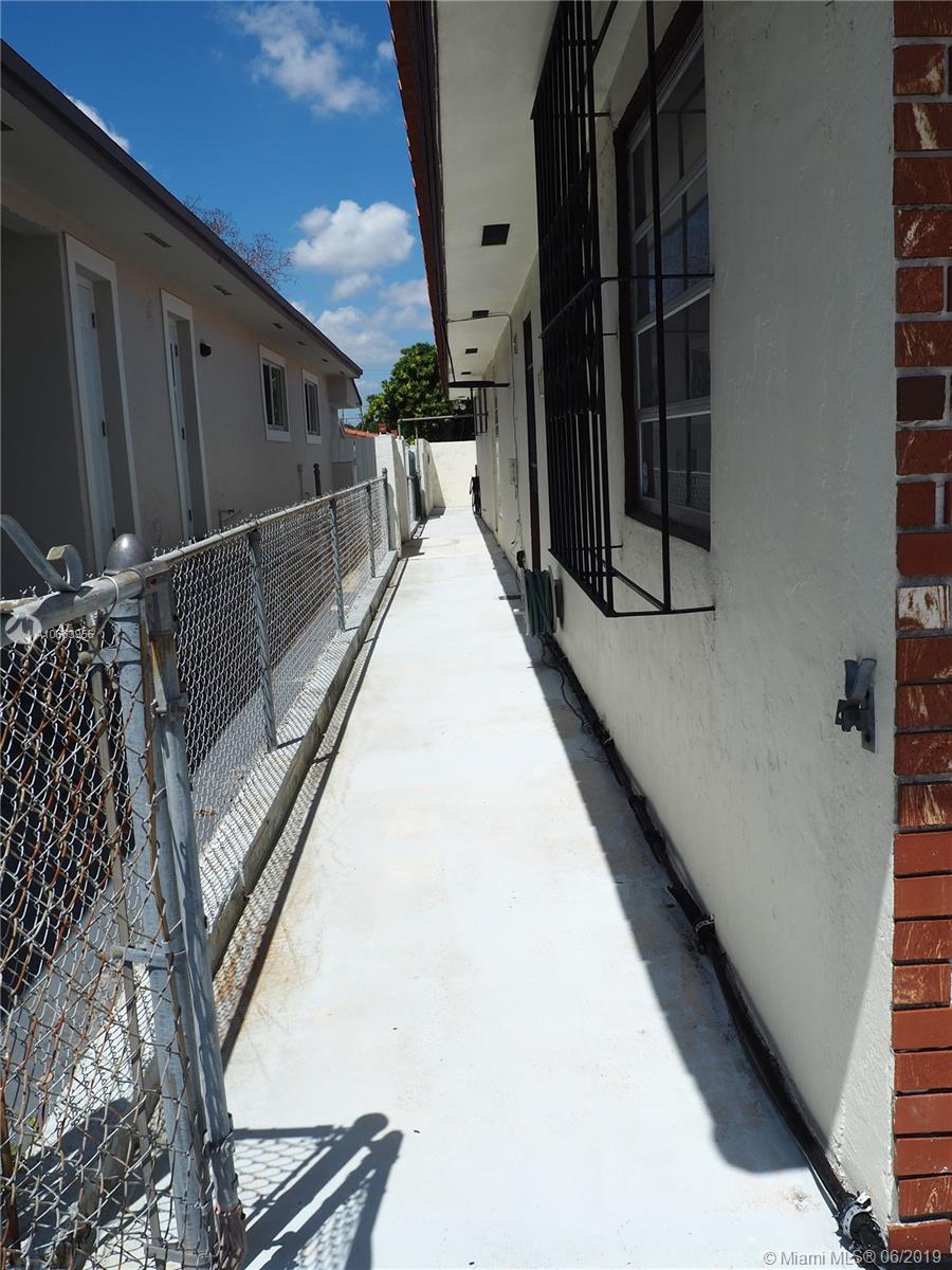 180 Northwest 59th Court Miami, FL 33126 - Photo 26 of 28 Back of home with full cement slab.