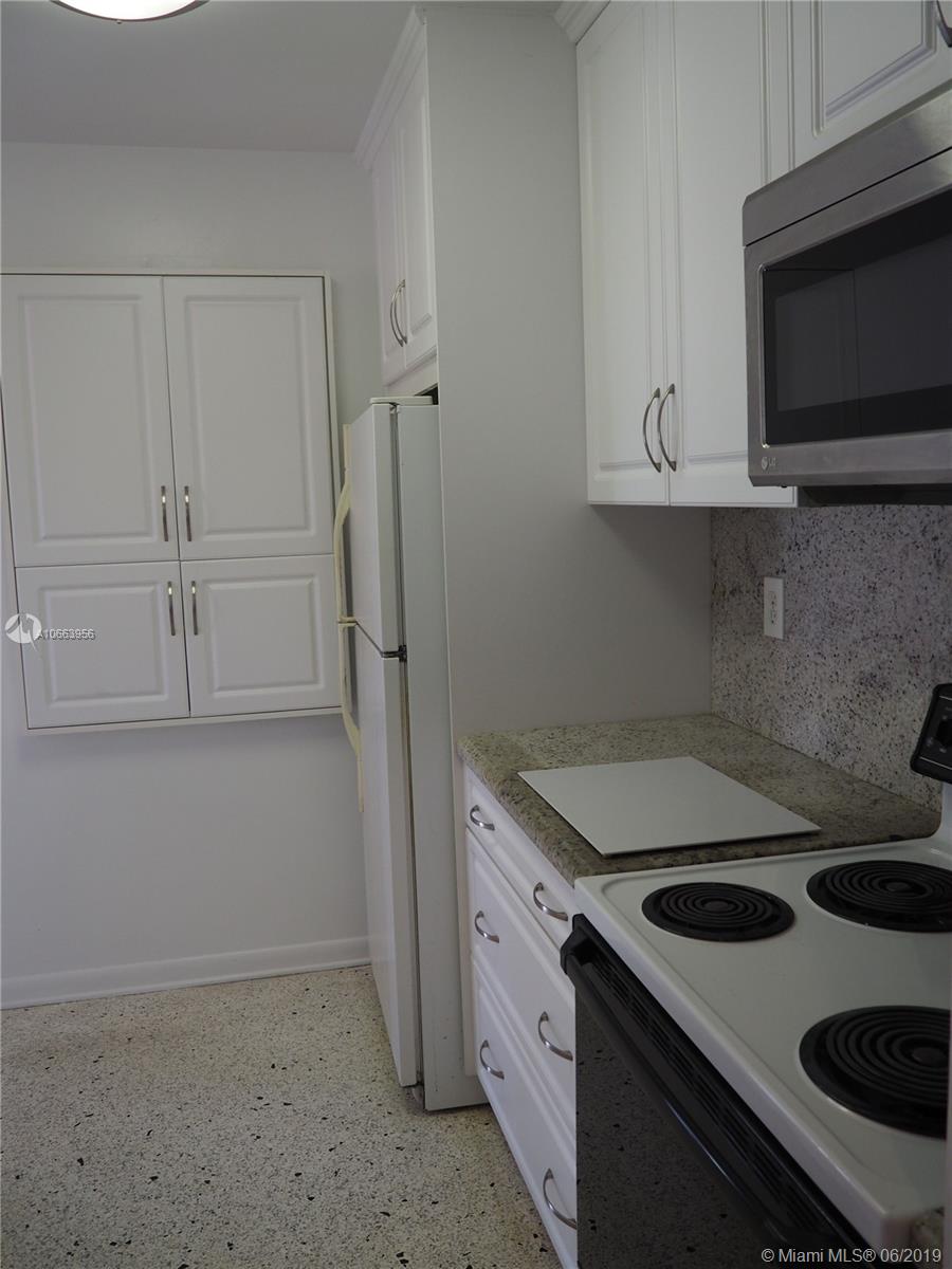 180 Northwest 59th Court Miami, FL 33126 - Photo 5 of 28 Kitchen features built in cabinets.