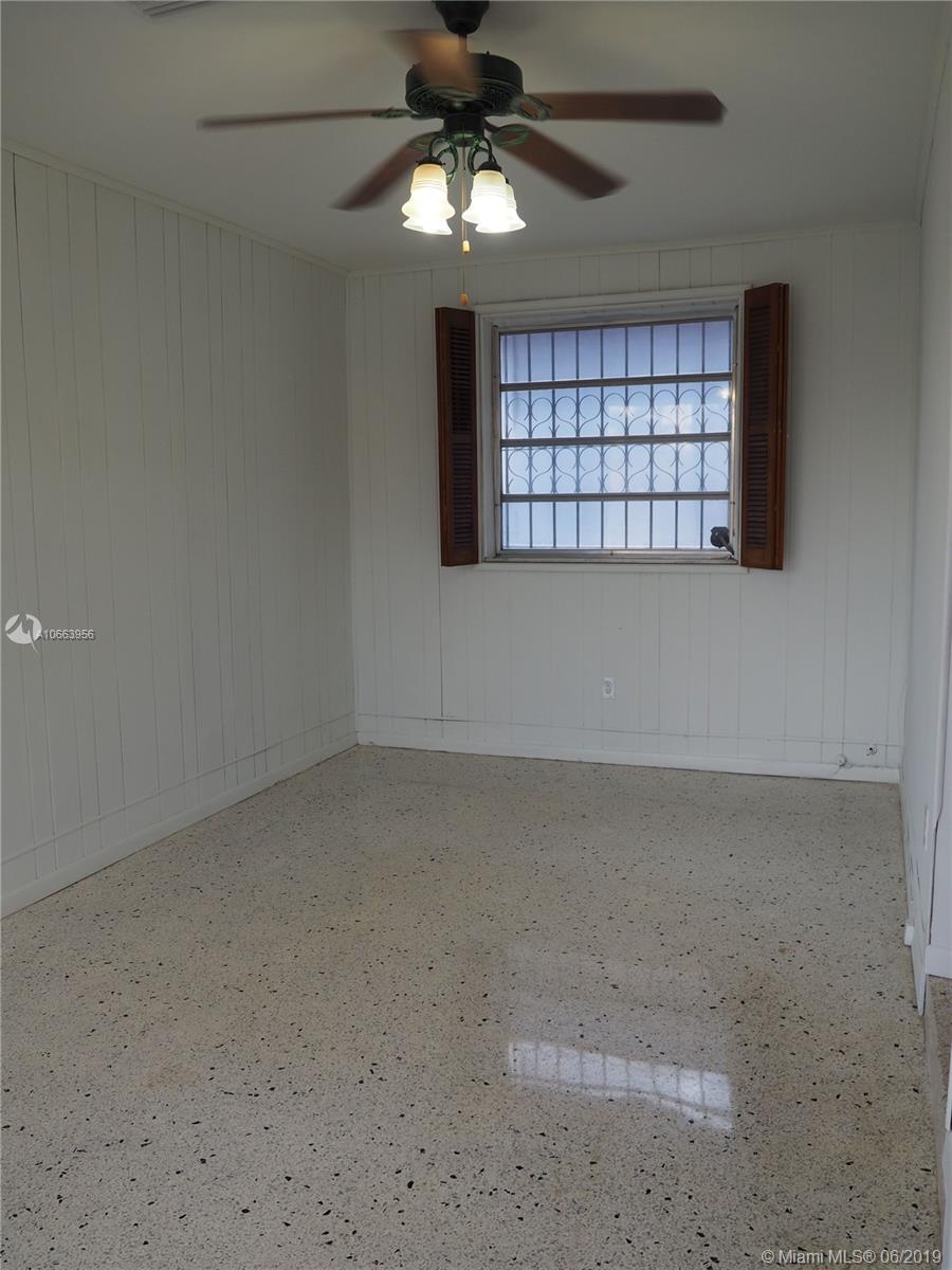 180 Northwest 59th Court Miami, FL 33126 - Photo 8 of 28 Family Room off of the Kitchen area. Beautifully kept Terrazzo Floors throughout home.