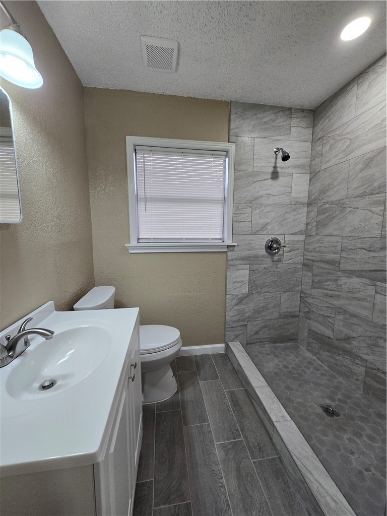 918 Stirman Street Corpus Christi, TX 78411 - Photo 8 of 13 a bathroom with a sink a toilet and shower