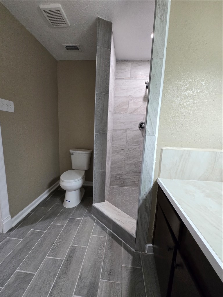 918 Stirman Street Corpus Christi, TX 78411 - Photo 9 of 13 a bathroom with a toilet and a shower
