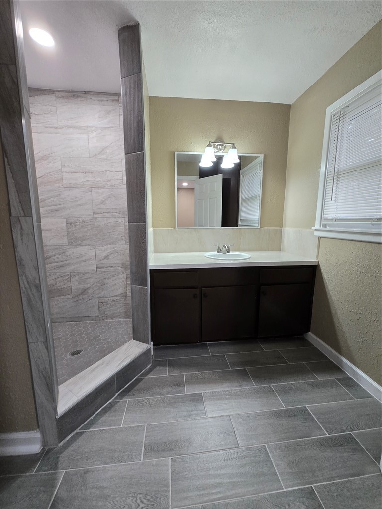 918 Stirman Street Corpus Christi, TX 78411 - Photo 10 of 13 a bathroom with a sink and a mirror