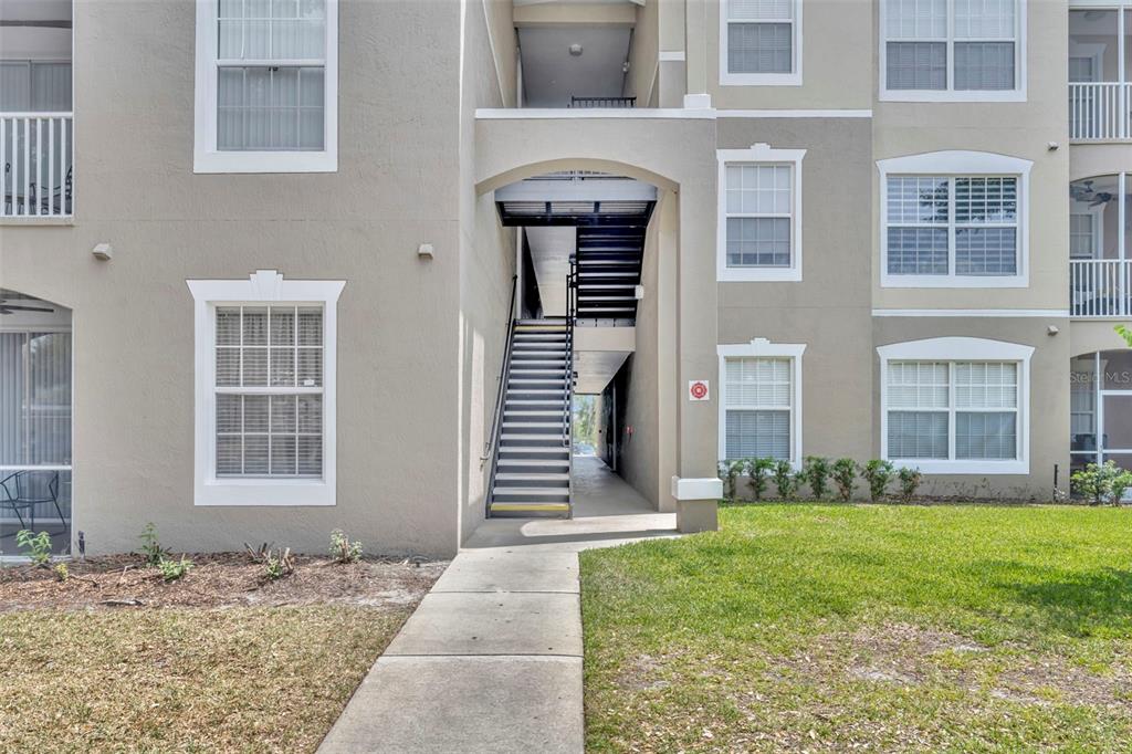 582 Brantley Terrace Way, Unit 304 Altamonte Springs, FL 32714 - Photo 6 of 30 a front view of a house with a yard