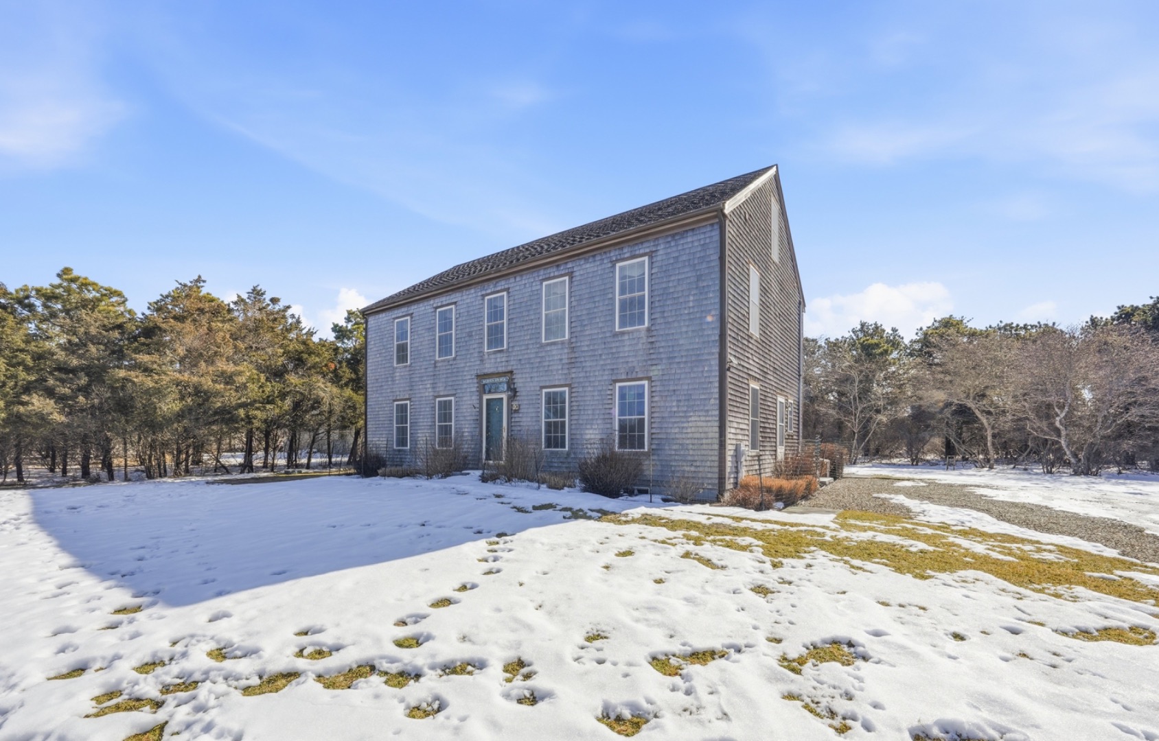 20 Rudder Lane Nantucket, MA 02554 - Photo 1 of 34 a building view with a wooden fence next to a yard
