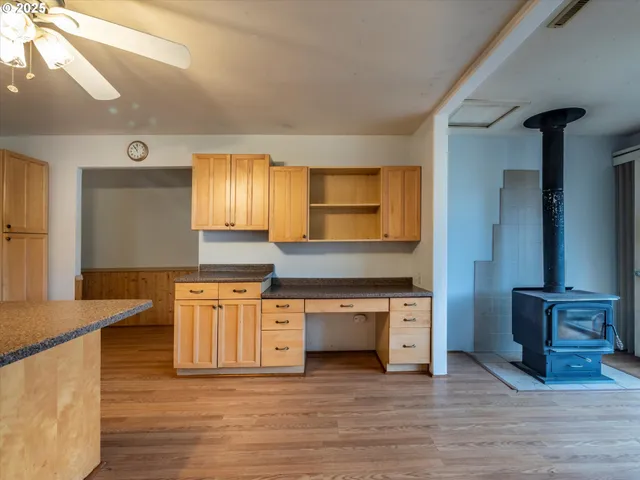 a kitchen with stainless steel appliances granite countertop a sink and a stove top oven