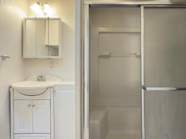 a bathroom with a sink a vanity and a mirror