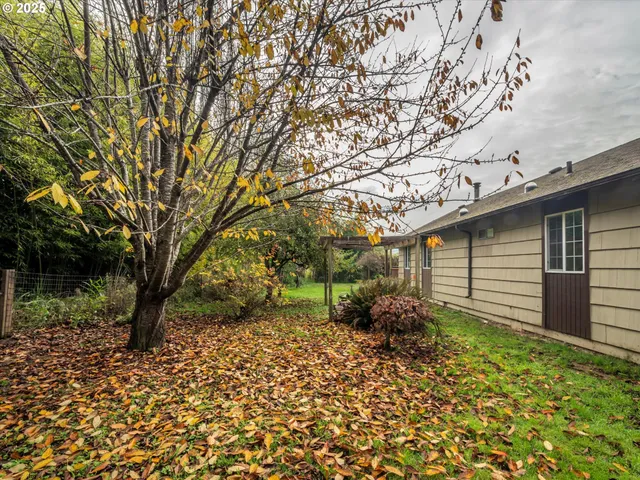 a backyard of a house with lots of green space