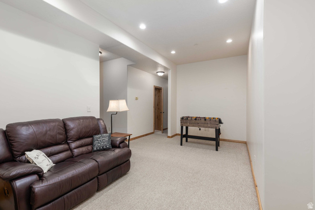 5168 Fairview Loop, Unit C604 Eden, UT 84310 - Photo 29 of 53 Living room with light colored carpet and recessed lighting
