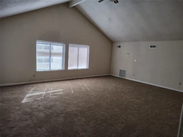 an empty room with a windows