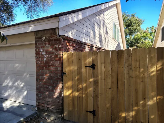 a bathroom with a shower and a glass door