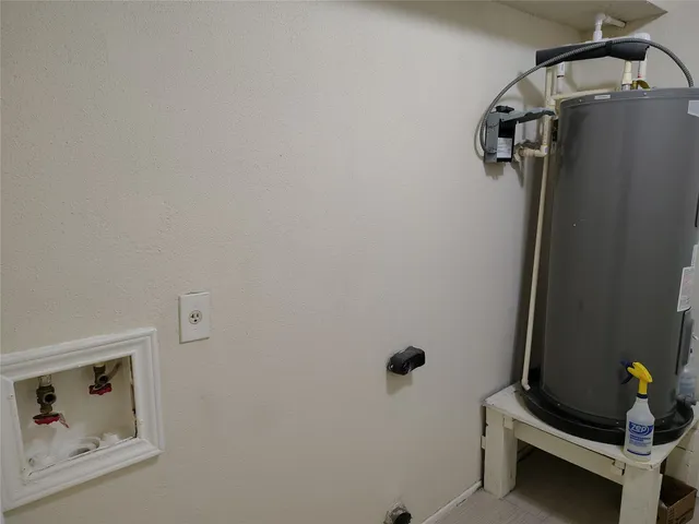 a view of a hallway with paintings on the wall