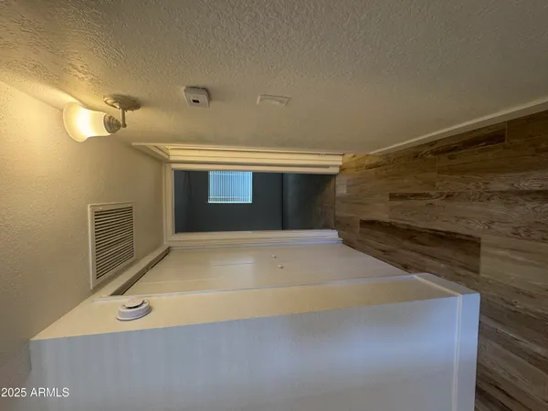 a bathroom with a sink a toilet a mirror and bathtub