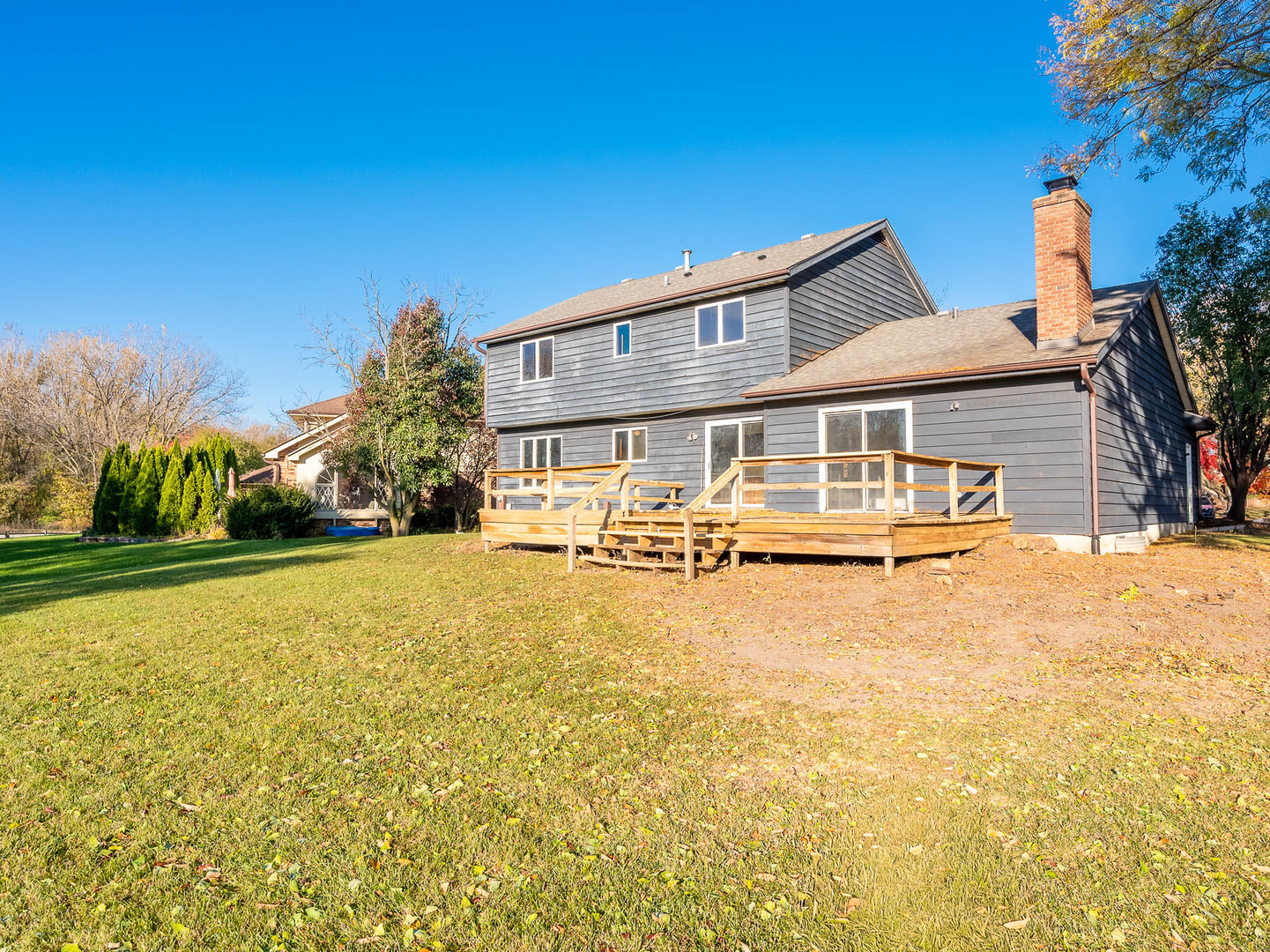 19 Cedar Gate Circle Sugar Grove, IL 60554 - Photo 16 of 17 a front view of house with yard and trees in the background