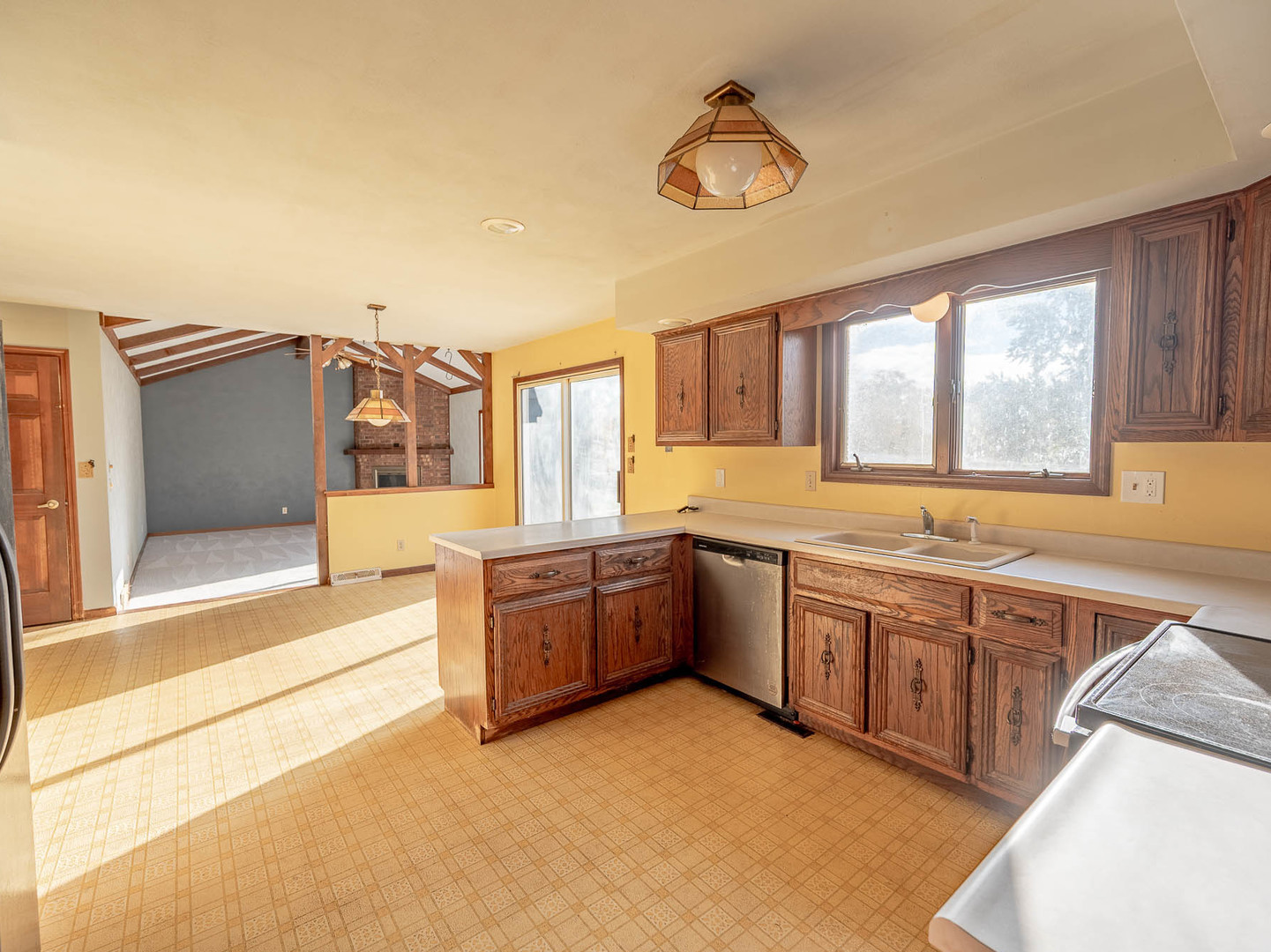 19 Cedar Gate Circle Sugar Grove, IL 60554 - Photo 6 of 17 a large kitchen with stainless steel appliances granite countertop a large window and a sink