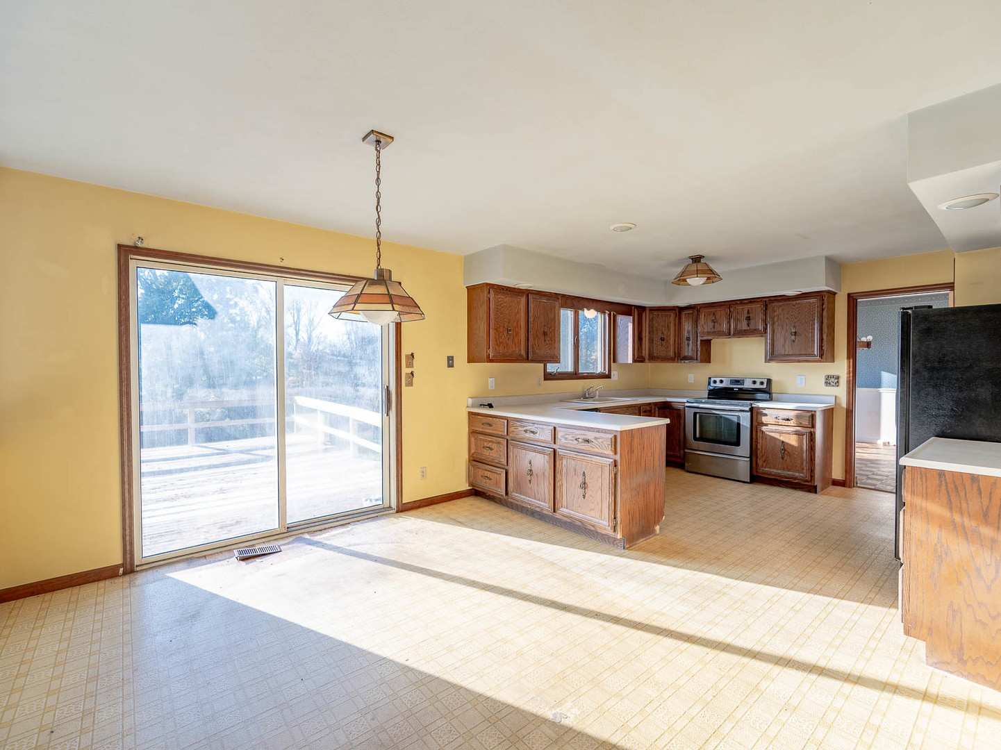 19 Cedar Gate Circle Sugar Grove, IL 60554 - Photo 7 of 17 a kitchen with stainless steel appliances granite countertop a stove a sink and a refrigerator with wooden floor