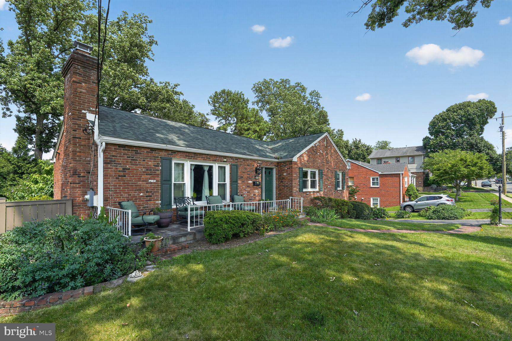 3919 Chesterbrook Road Arlington, VA 22207 - Photo 3 of 26 a front view of house with yard and green space