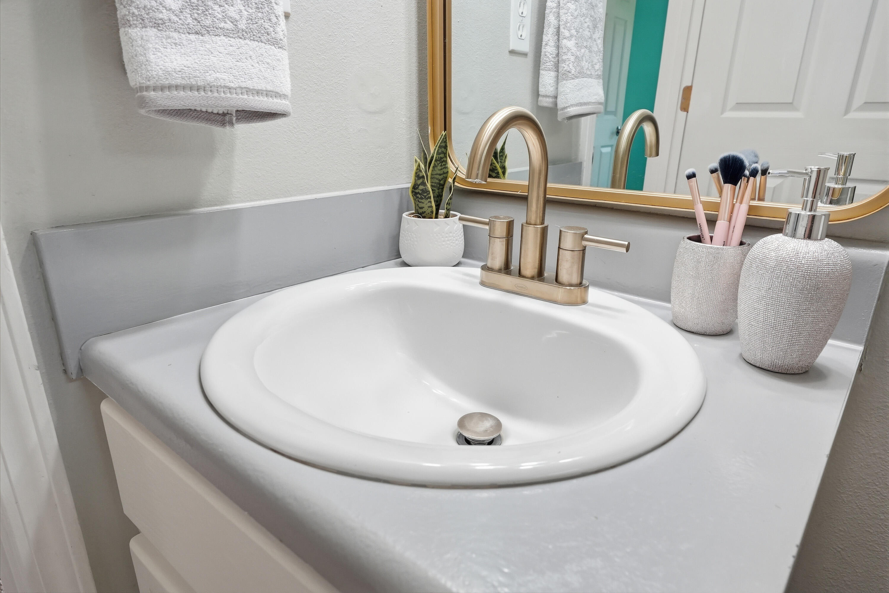 3033 Cabela Lane Crestview, FL 32539 - Photo 22 of 32 a bathroom with a sink and mirror