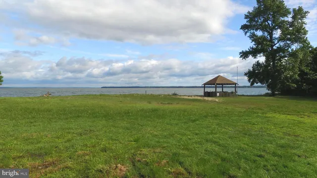 a view of house with garden and balcony