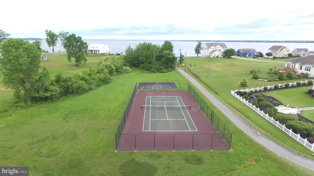 a view of a swimming pool with a yard