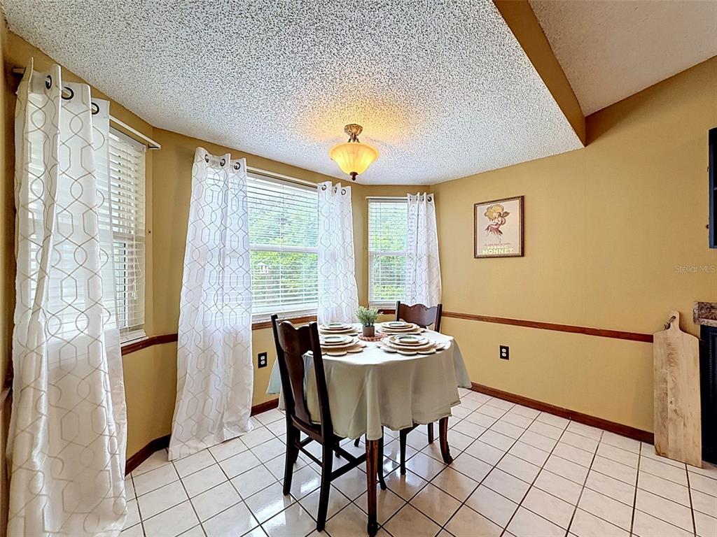7111 Ricker Avenue Webster, FL 33597 - Photo 12 of 41 a dining room with furniture and window