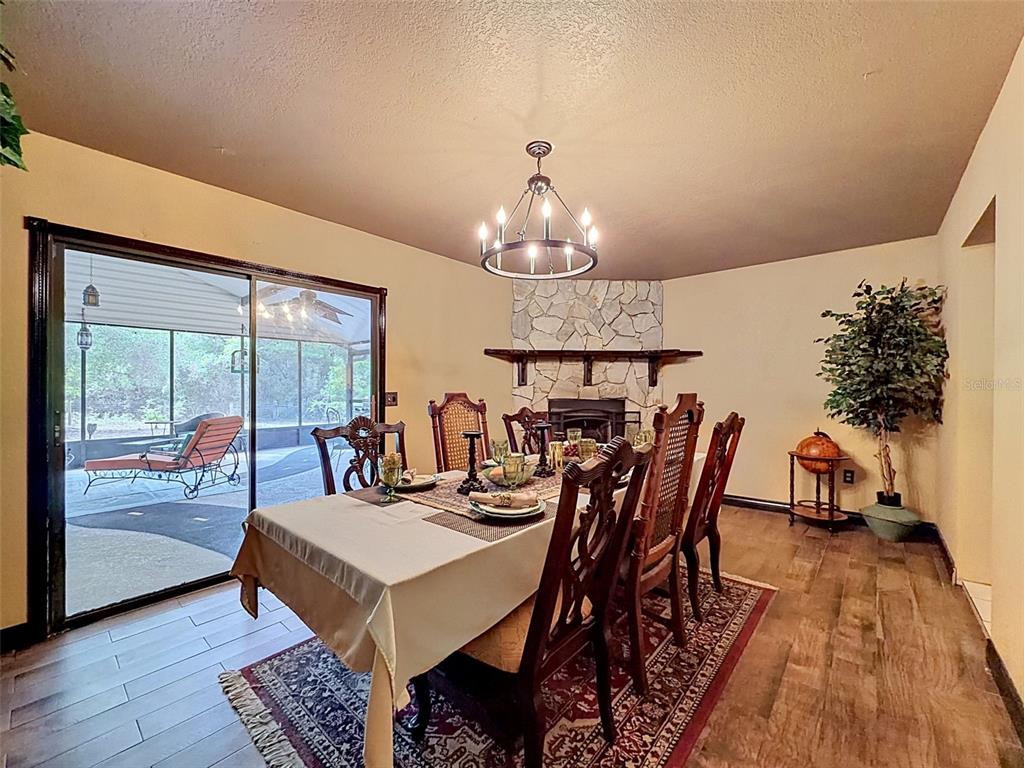 7111 Ricker Avenue Webster, FL 33597 - Photo 17 of 41 a view of a dining room with furniture window and wooden floor