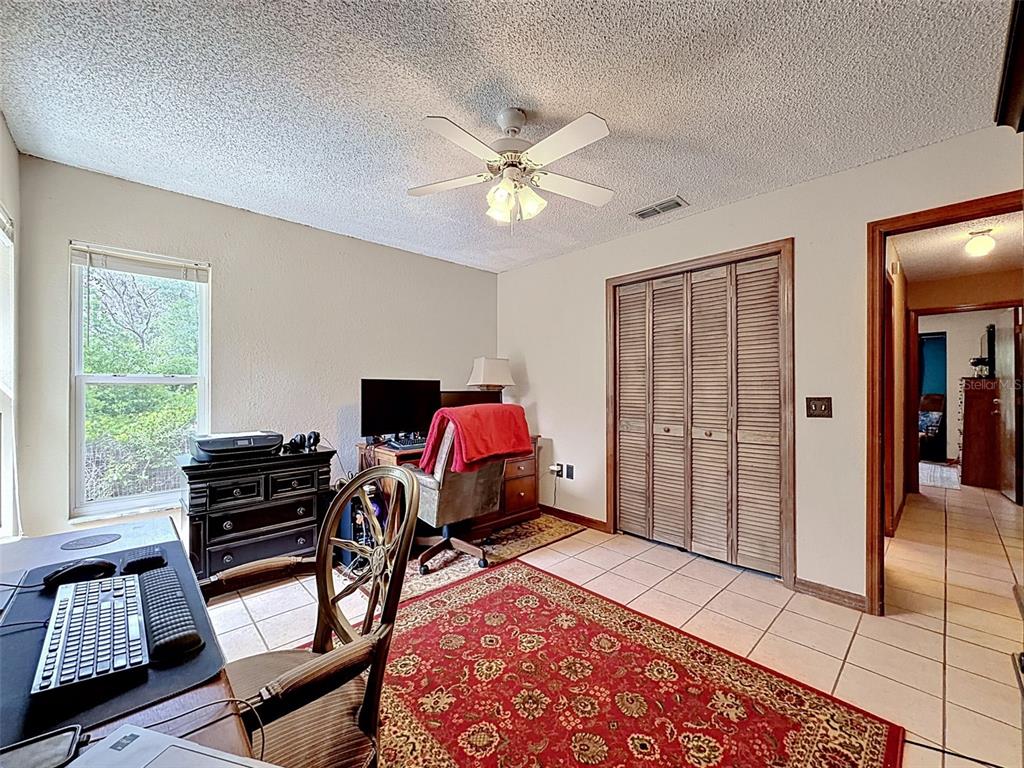 7111 Ricker Avenue Webster, FL 33597 - Photo 28 of 41 a bedroom with furniture and a window