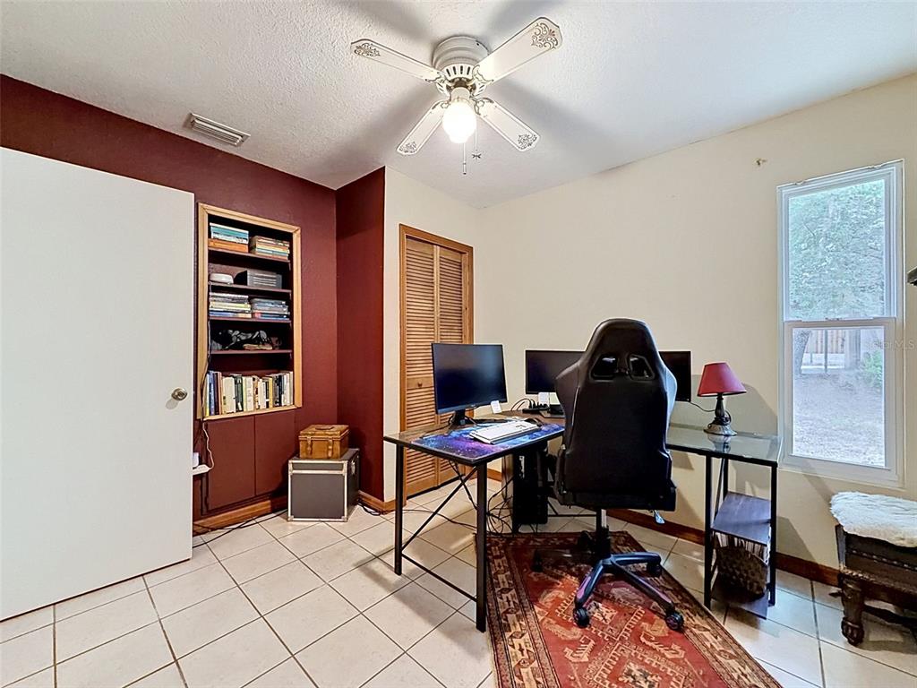 7111 Ricker Avenue Webster, FL 33597 - Photo 30 of 41 a view of a workspace with furniture and a window