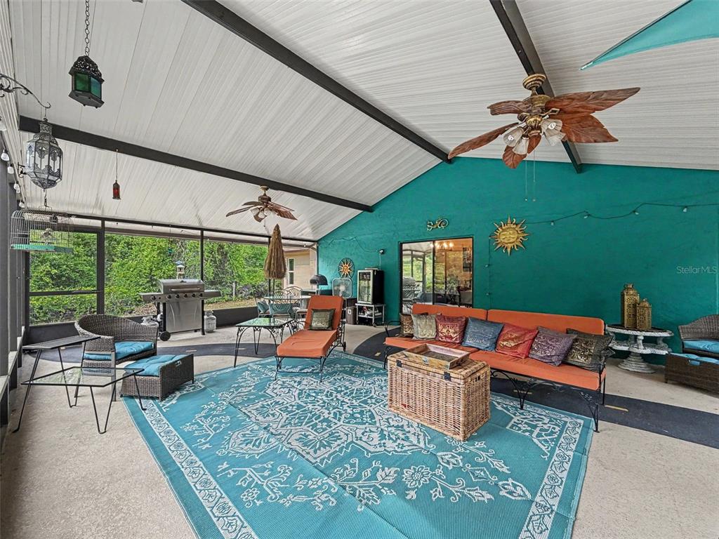 7111 Ricker Avenue Webster, FL 33597 - Photo 33 of 41 a outdoor living space with furniture and a fireplace