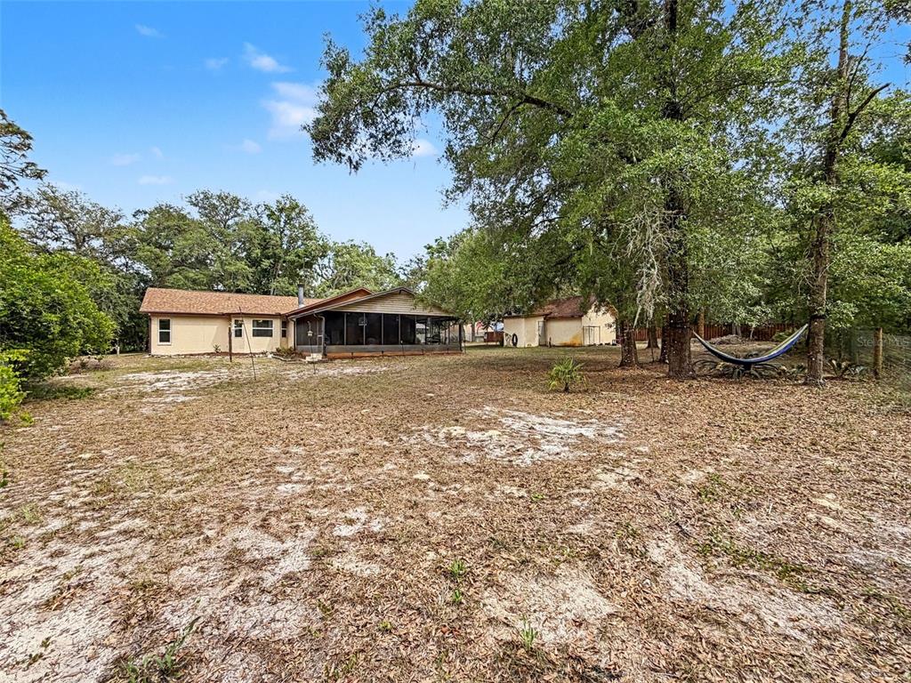 7111 Ricker Avenue Webster, FL 33597 - Photo 35 of 41 a front view of a house with a yard
