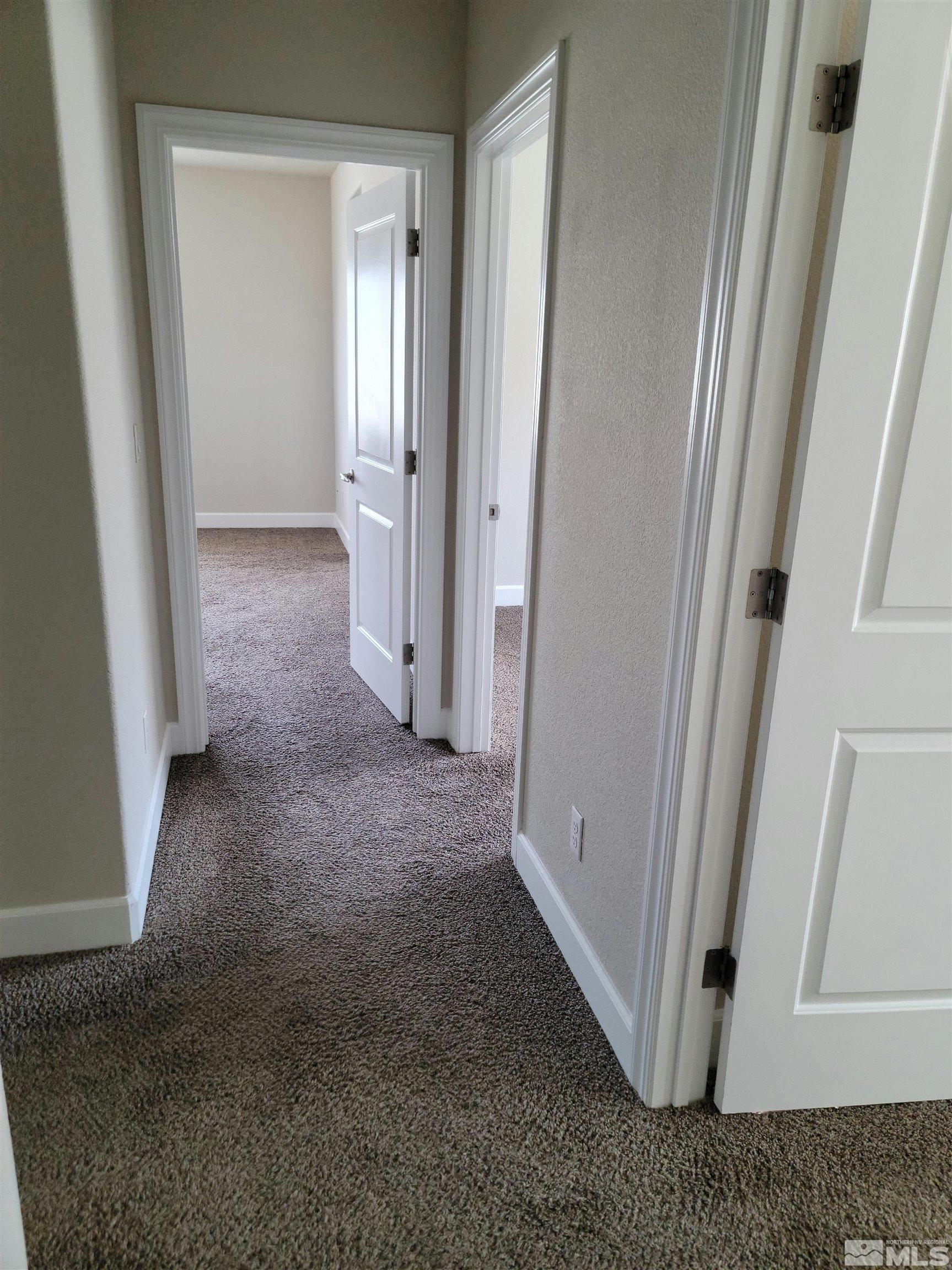 591 White Eagle Lane Fernley, NV 89408 - Photo 14 of 22 an empty room with windows