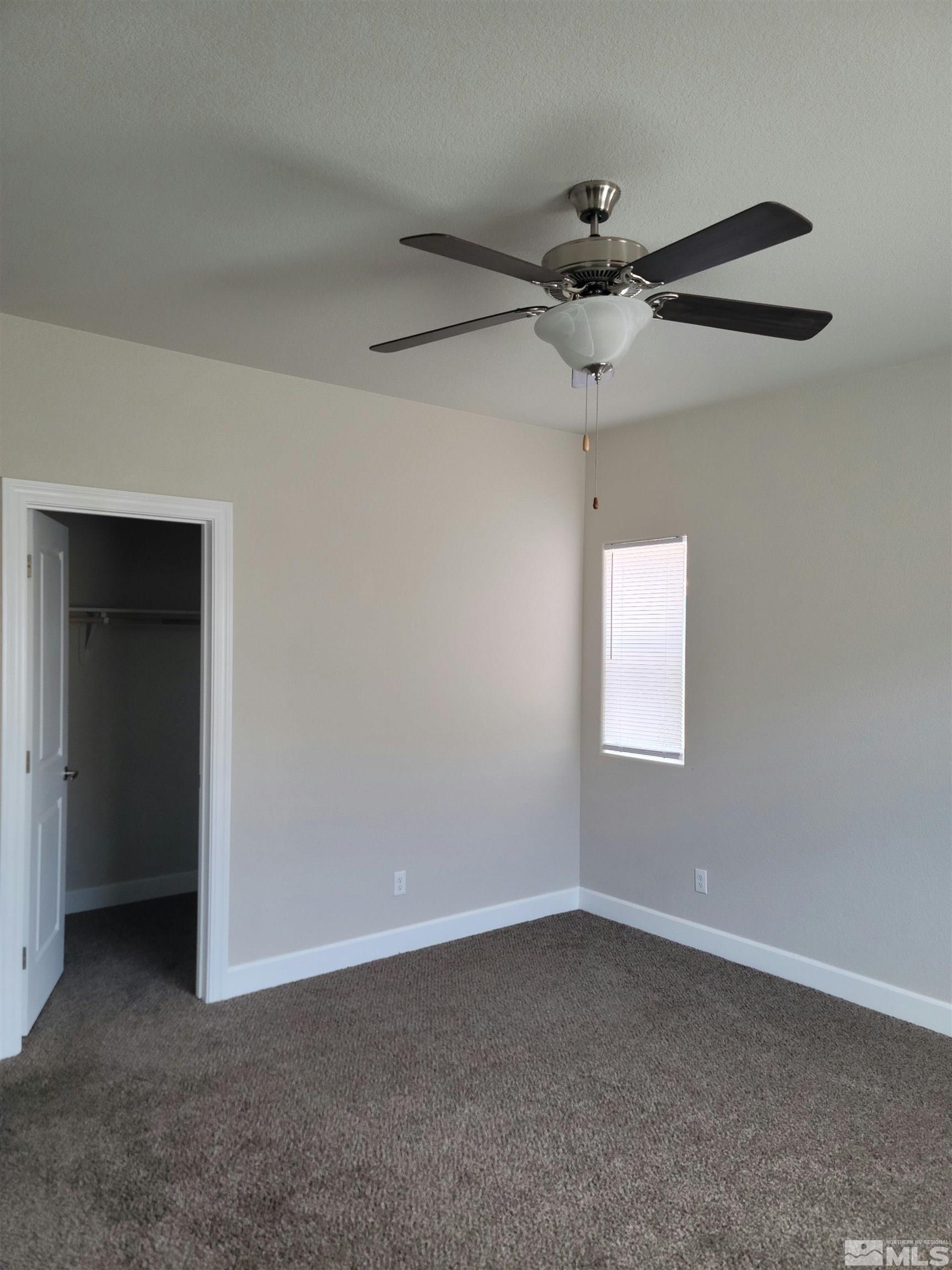 591 White Eagle Lane Fernley, NV 89408 - Photo 18 of 22 a view of an empty room with a window