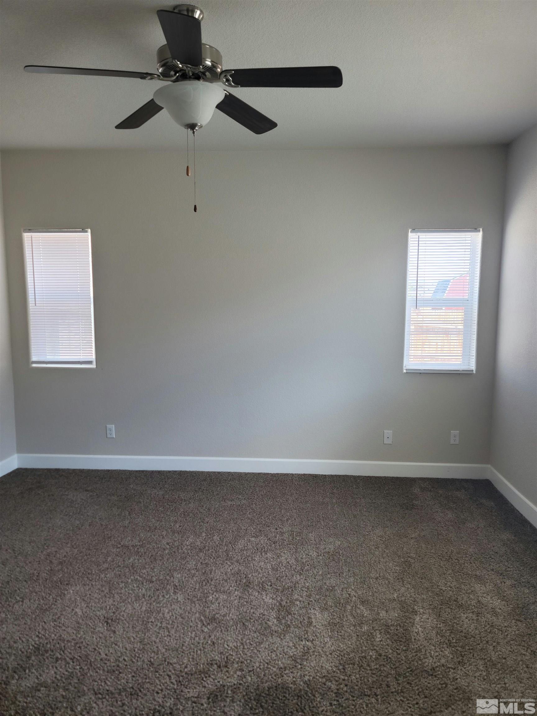591 White Eagle Lane Fernley, NV 89408 - Photo 19 of 22 a view of an empty room with a window
