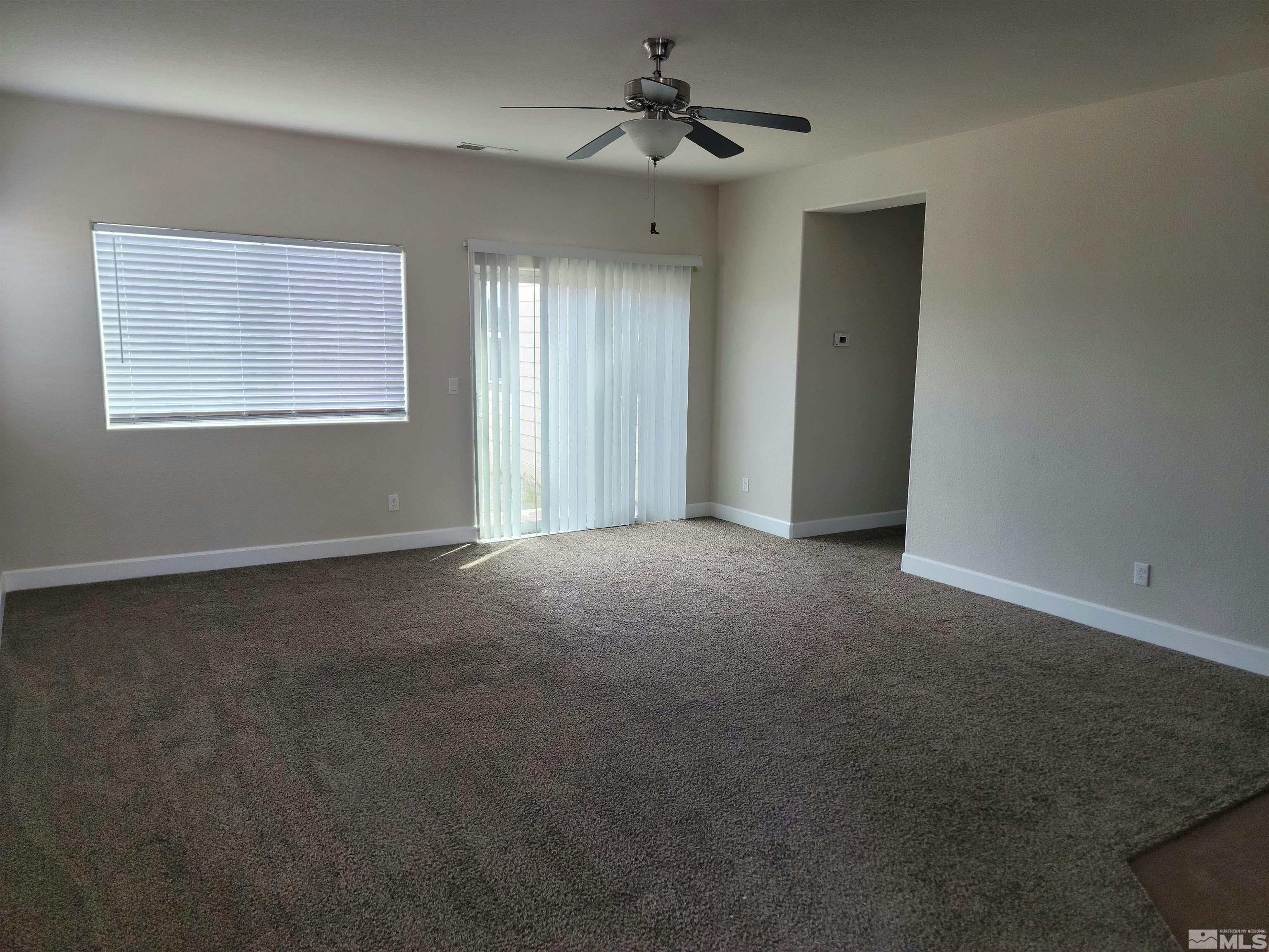 591 White Eagle Lane Fernley, NV 89408 - Photo 2 of 22 a view of an empty room with a window