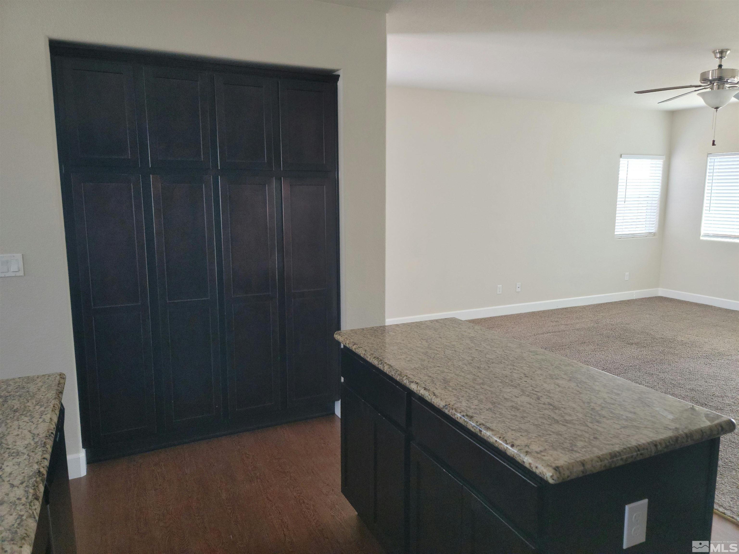 591 White Eagle Lane Fernley, NV 89408 - Photo 8 of 22 an empty room with closet