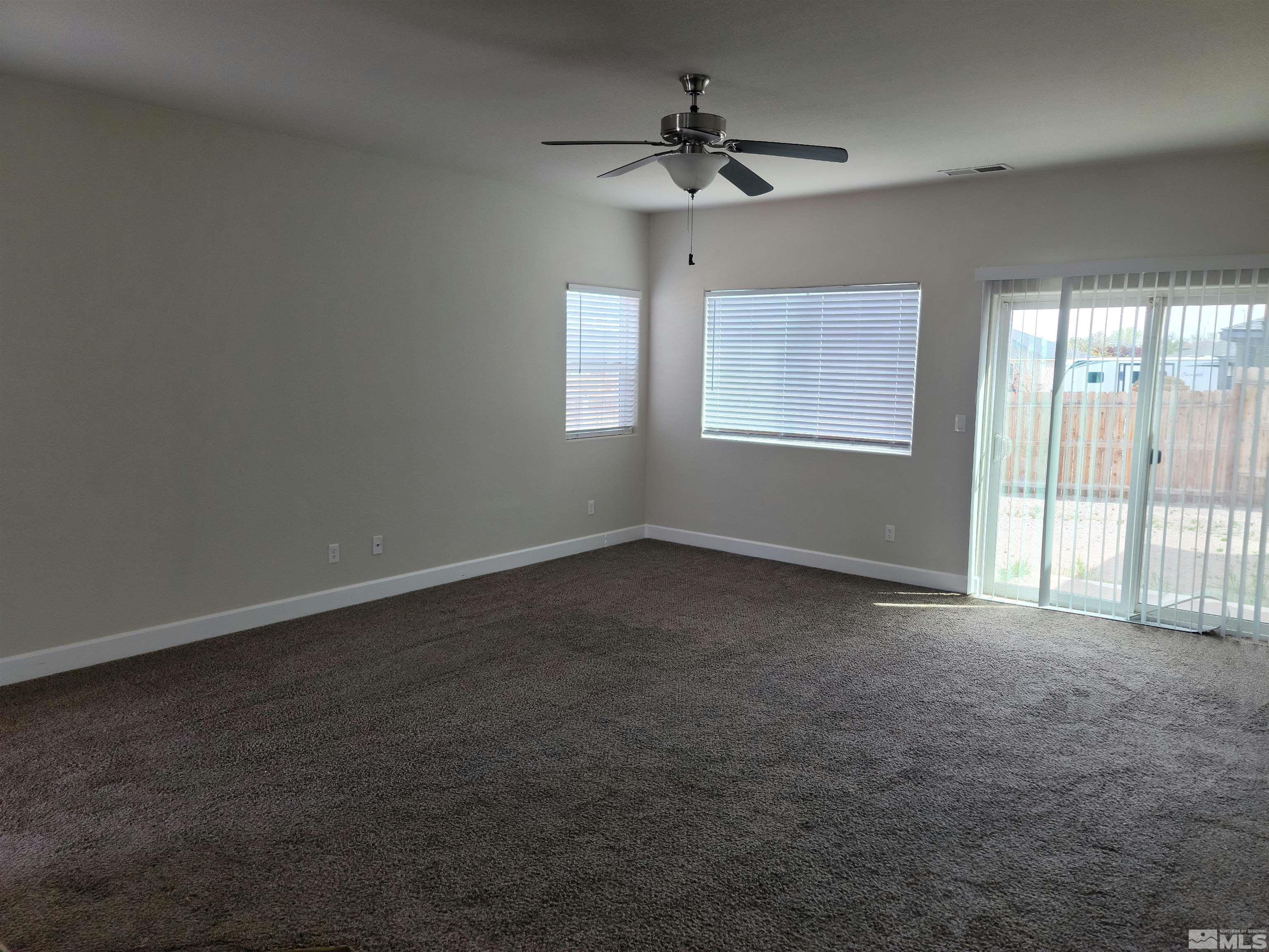 591 White Eagle Lane Fernley, NV 89408 - Photo 9 of 22 a view of an empty room with a window