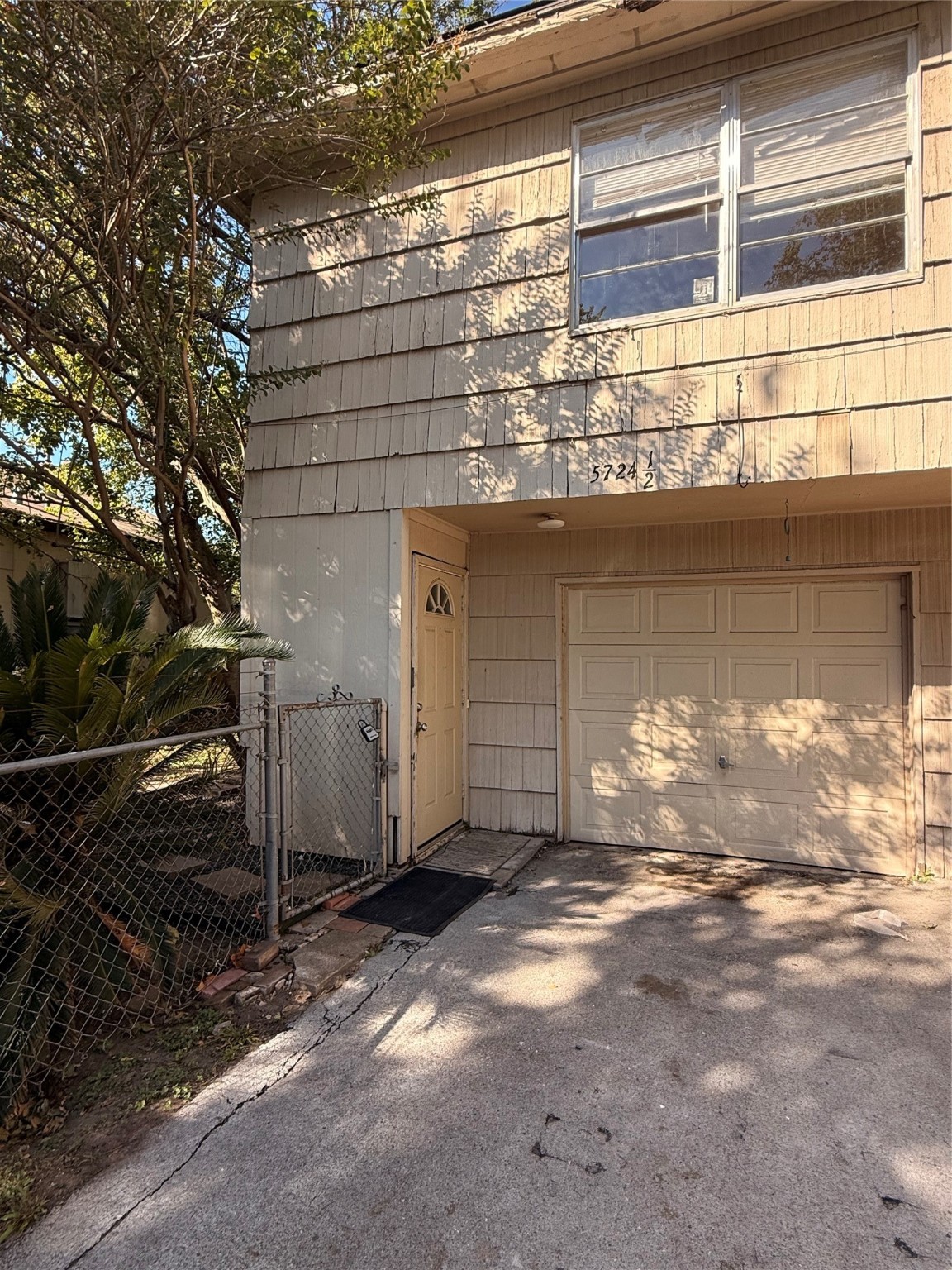 5724 1/2 Parwill Street Houston, TX 77081 - Photo 14 of 14 a view of a house with a street