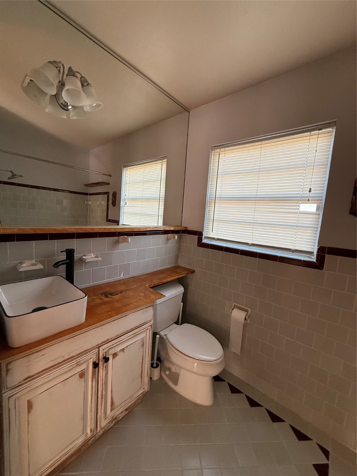 5724 1/2 Parwill Street Houston, TX 77081 - Photo 7 of 14 a view of bathroom with a sink and a toilet