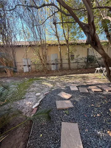 a backyard of a house with lots of green space