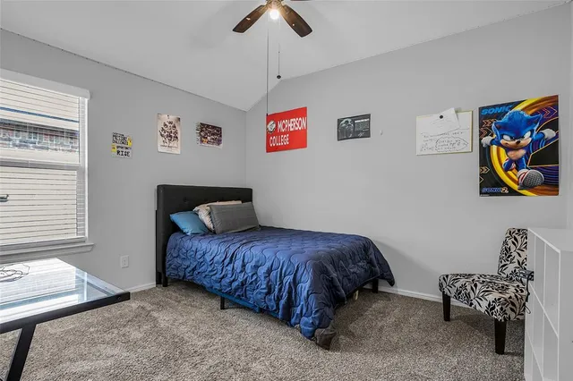 a bedroom with a bed and a couch