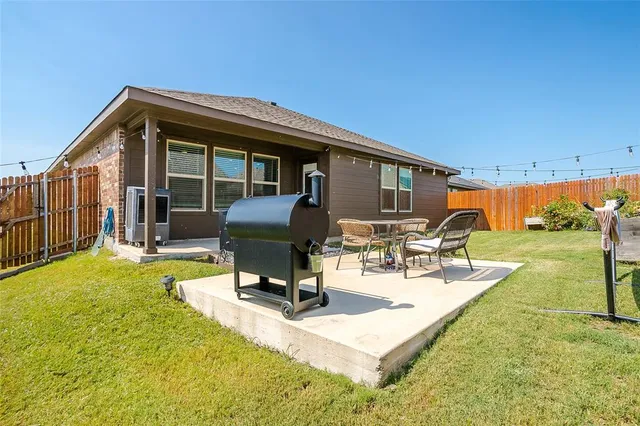 a view of a house with backyard porch and patio